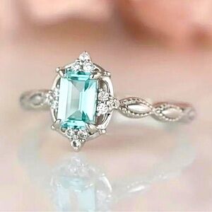 NWT Beautiful, dainty Silver Plated Aquamarine Ring. Size 6.